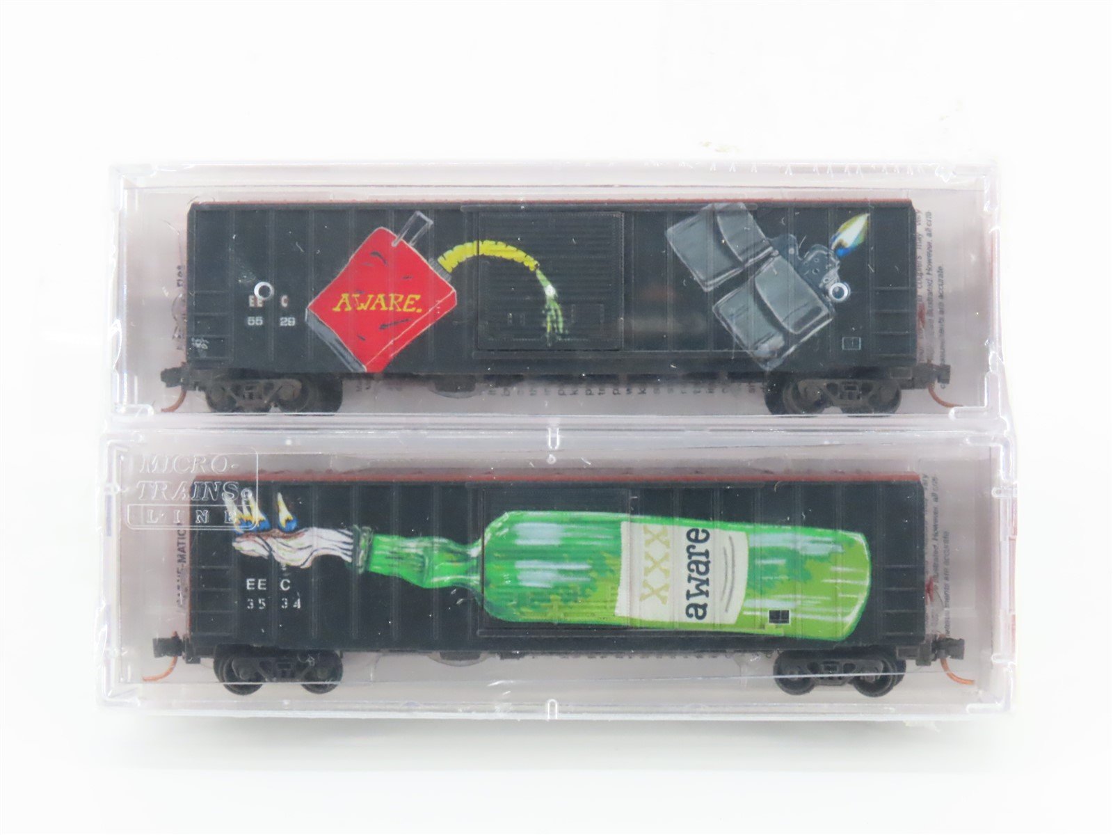 N Scale Micro-Trains MTL #02544870 EEC 50' Box Cars 2-Pk. - w/ "Aware" Graffiti