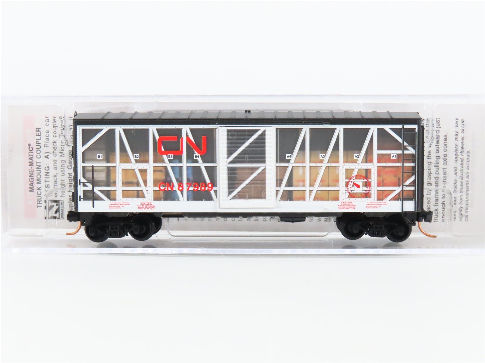 N Scale Micro-Trains MTL 07300250 CN Transparent 40" Box Car #87989 W/ Load