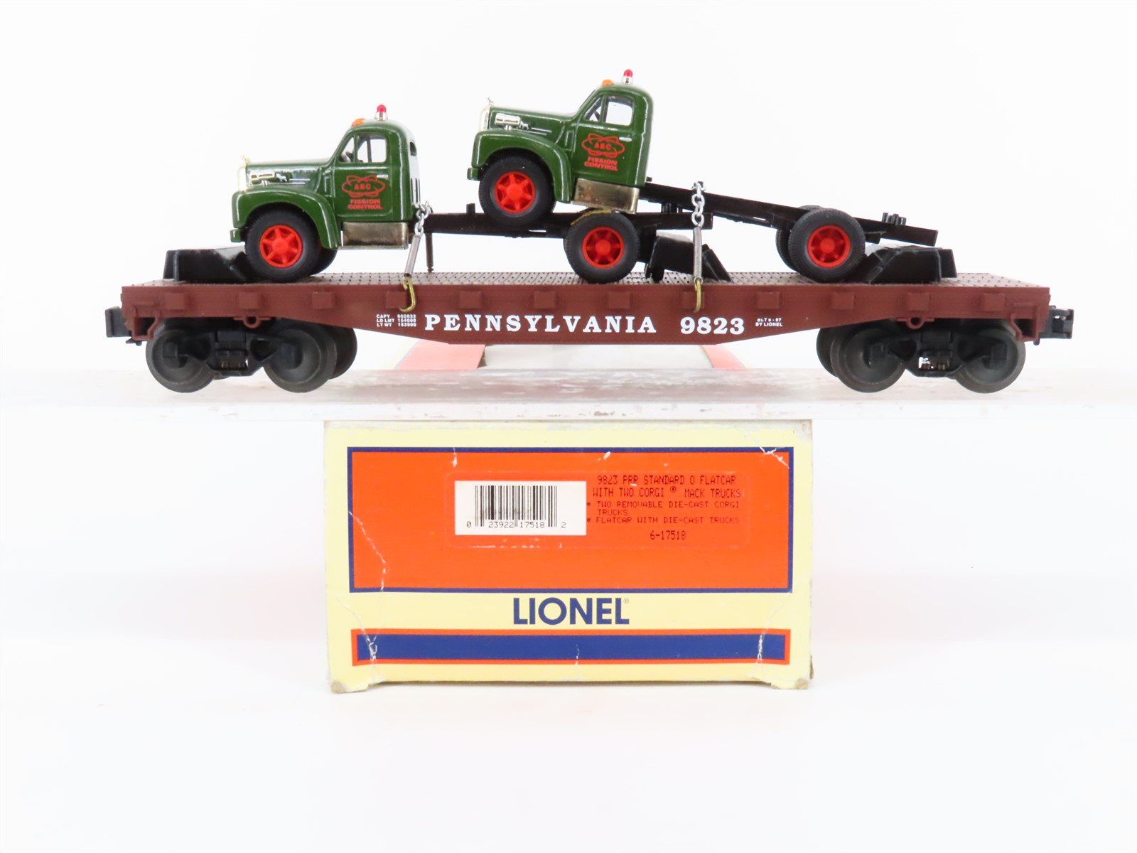 O Gauge 3-Rail Lionel 6-17518 PRR Pennsylvania Flat Car w/ 2 Corgi Mack Trucks