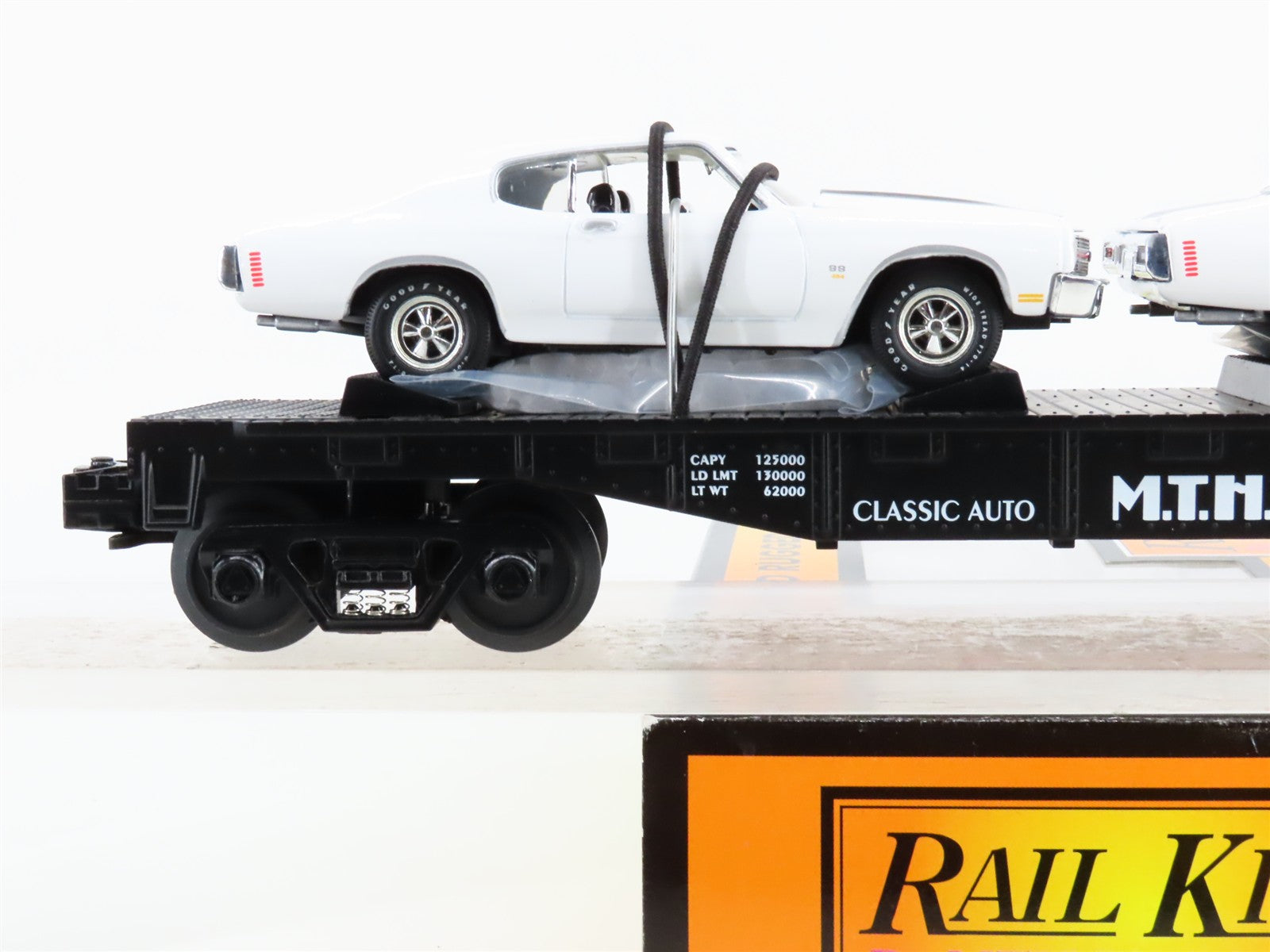 O Scale MTH 30-7680 MTH Transport Flat Car w/ ERTL '70 Chevelles 1970 RTR