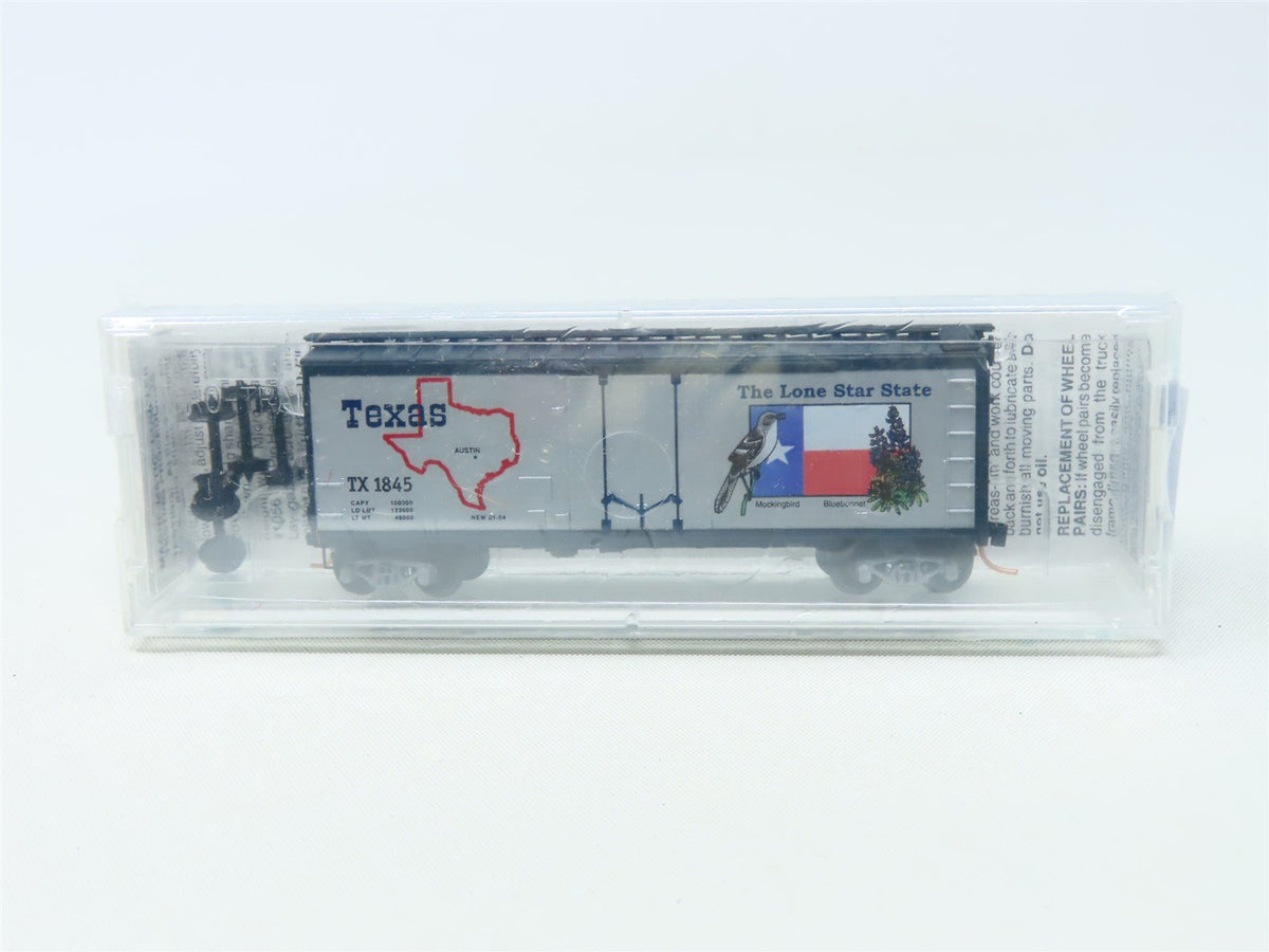 N Scale Micro-Trains MTL 21374 TX Texas State 40&#39; Plug Door Box Car #1845 Sealed